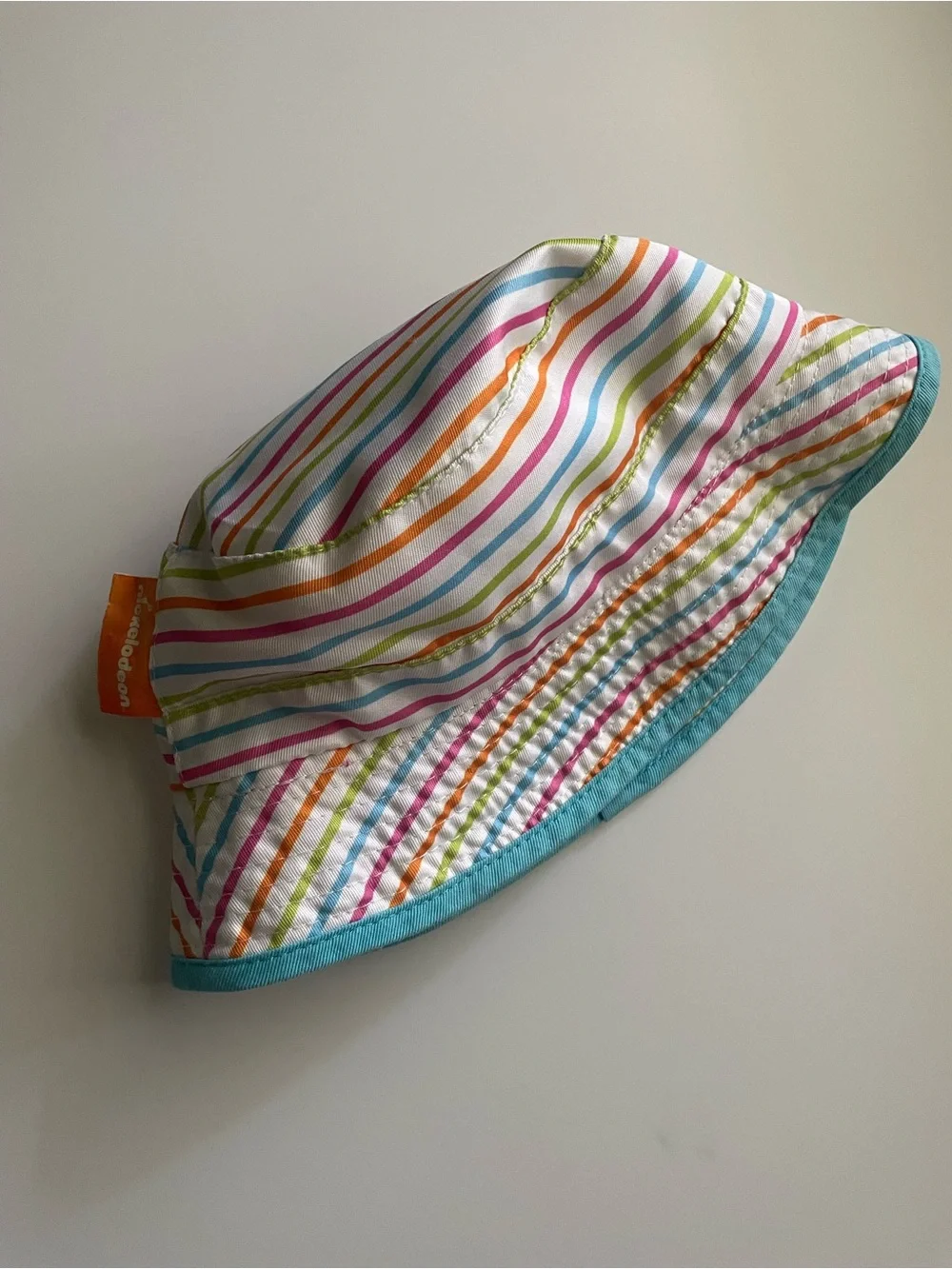 Paw Patrol Rainbow Stripe Reversible Bucket Hat in Yellow, Pink, Orange & Blue